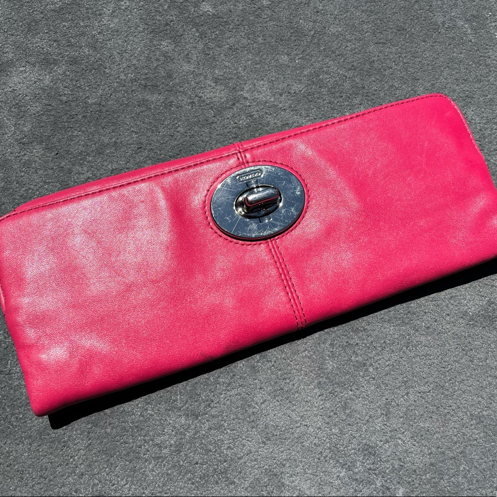 Hot pink Coach fold over leather clutch